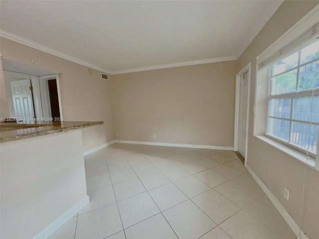 924 SE 2nd St Unit 9, Fort Lauderdale, FL 33301 - spare room featuring light tile patterned floors and ornamental molding