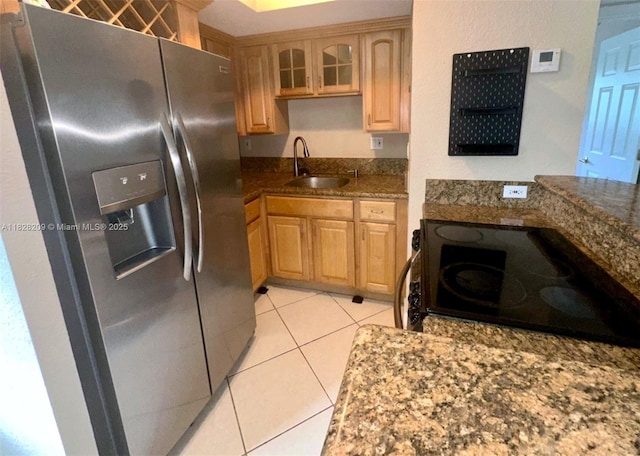 924 SE 2nd St Unit 9, Fort Lauderdale, FL 33301 - kitchen featuring stainless steel fridge, range with electric stovetop, light brown cabinets, and light tile patterned flooring