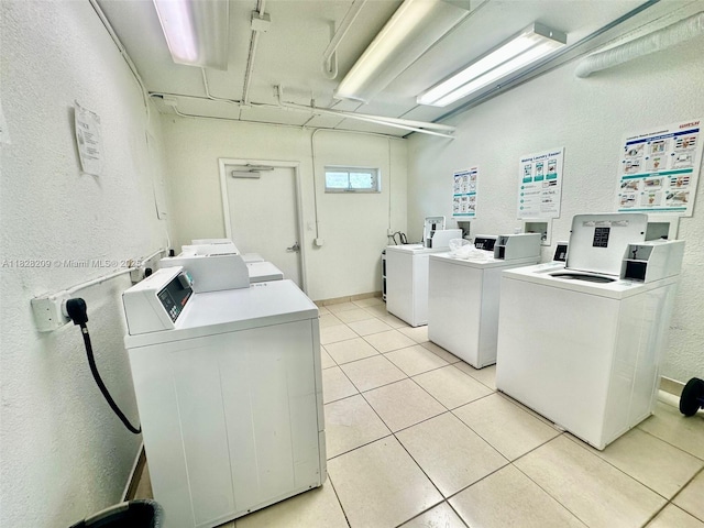 924 SE 2nd St Unit 9, Fort Lauderdale, FL 33301 - shared laundry with washer and clothes dryer, a textured wall, and light tile patterned floors