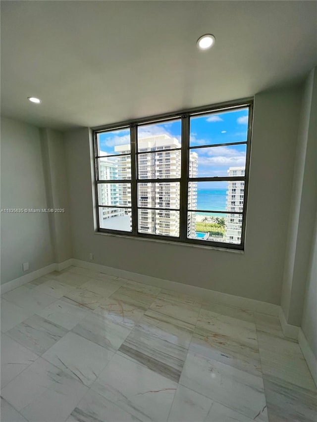 5700 Collins Ave Unit 16B, Miami Beach, FL 33140 - unfurnished room featuring recessed lighting and light marble finish flooring