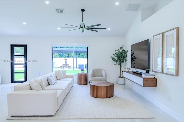 1149 SE Sandia Dr, Port St Lucie, FL 34983 - living room with recessed lighting, ceiling fan, and lofted ceiling