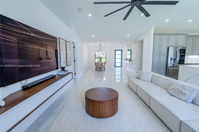 1149 SE Sandia Dr, Port St Lucie, FL 34983 - living room with recessed lighting, a ceiling fan, a chandelier, high vaulted ceiling, and light tile patterned flooring