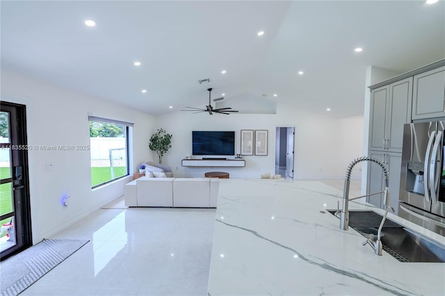 1149 SE Sandia Dr, Port St Lucie, FL 34983 - living room featuring vaulted ceiling, a ceiling fan, recessed lighting, and light tile patterned flooring