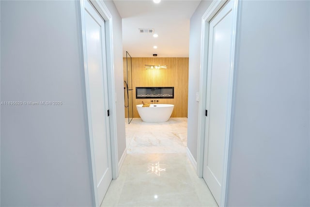 1149 SE Sandia Dr, Port St Lucie, FL 34983 - hall with light marble finish flooring and recessed lighting