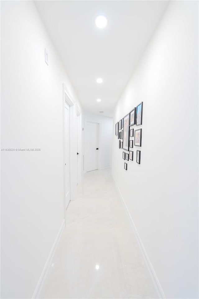 1149 SE Sandia Dr, Port St Lucie, FL 34983 - hall featuring baseboards and recessed lighting