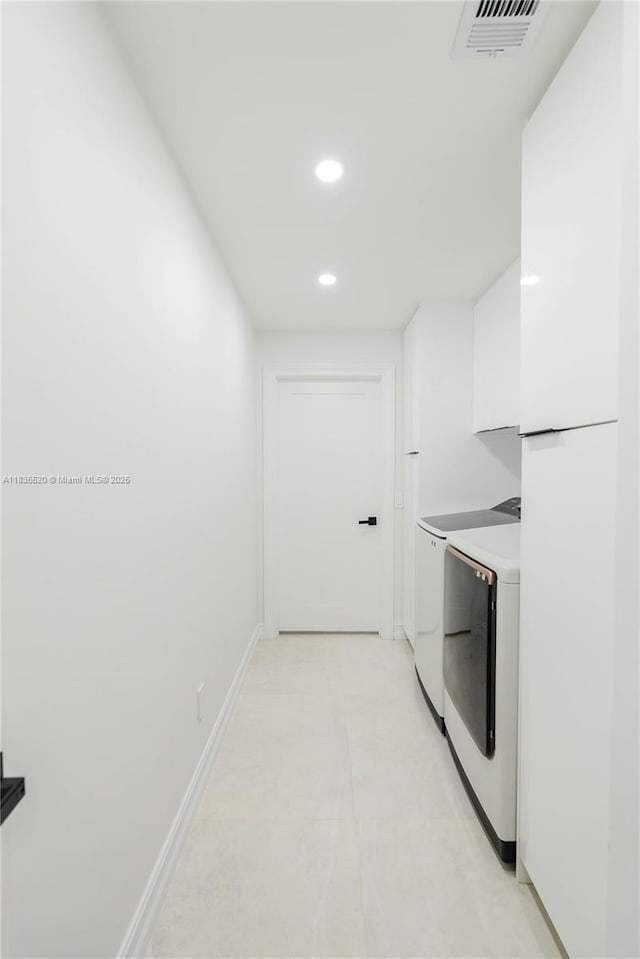 1149 SE Sandia Dr, Port St Lucie, FL 34983 - laundry room with washing machine and dryer and recessed lighting