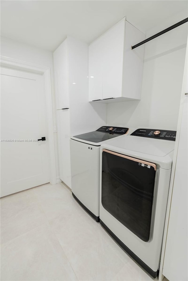 1149 SE Sandia Dr, Port St Lucie, FL 34983 - laundry area with washer and dryer and cabinet space