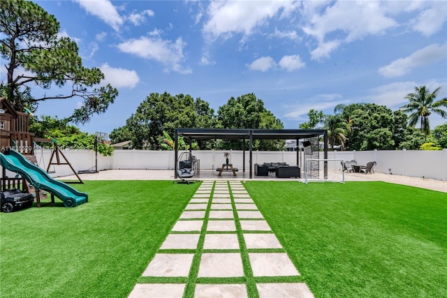 1149 SE Sandia Dr, Port St Lucie, FL 34983 - fenced backyard featuring a patio area, an outdoor hangout area, and a playground