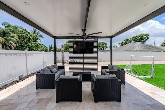 1149 SE Sandia Dr, Port St Lucie, FL 34983 - fenced backyard with a patio, outdoor lounge area, and a ceiling fan