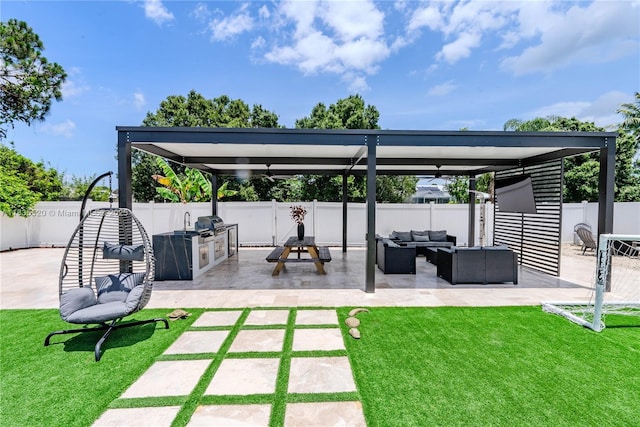 1149 SE Sandia Dr, Port St Lucie, FL 34983 - fenced backyard featuring an outdoor living space, a patio, and area for grilling