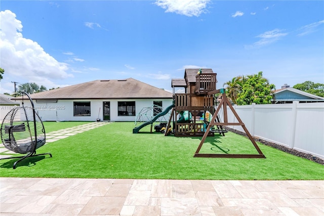 1149 SE Sandia Dr, Port St Lucie, FL 34983 - community play area with a fenced backyard