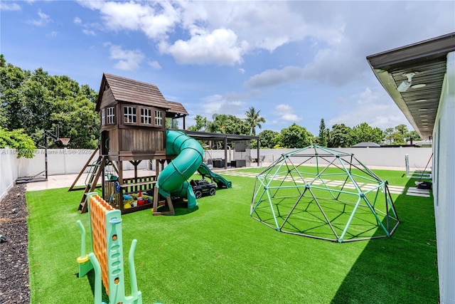 1149 SE Sandia Dr, Port St Lucie, FL 34983 - view of jungle gym featuring a fenced backyard