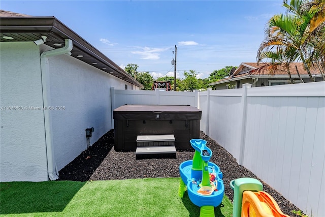 1149 SE Sandia Dr, Port St Lucie, FL 34983 - fenced backyard featuring a hot tub
