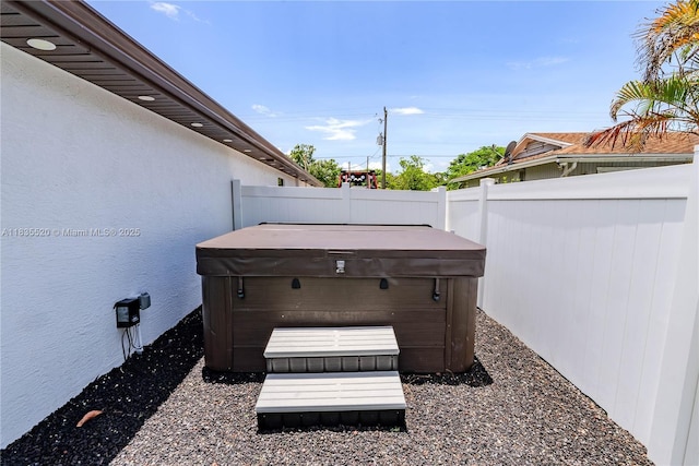 1149 SE Sandia Dr, Port St Lucie, FL 34983 - view of patio / terrace featuring a hot tub