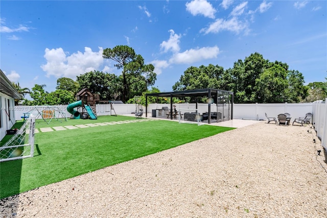 1149 SE Sandia Dr, Port St Lucie, FL 34983 - fenced backyard featuring a patio area, a playground, and a hot tub