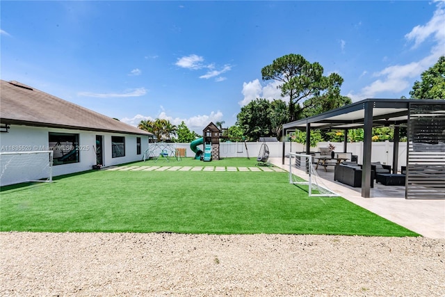 1149 SE Sandia Dr, Port St Lucie, FL 34983 - view of yard with outdoor lounge area, a playground, and a patio area