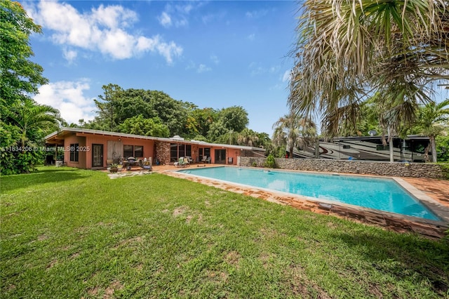 6801 SW 136th St, Pinecrest, FL 33156 - outdoor pool featuring a yard and a patio area