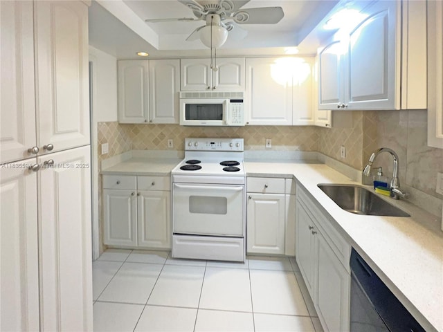 2000 S Ocean Blvd Unit 16P, Lauderdale By The Sea, FL 33062 - kitchen with white appliances, light tile patterned floors, ceiling fan, and decorative backsplash