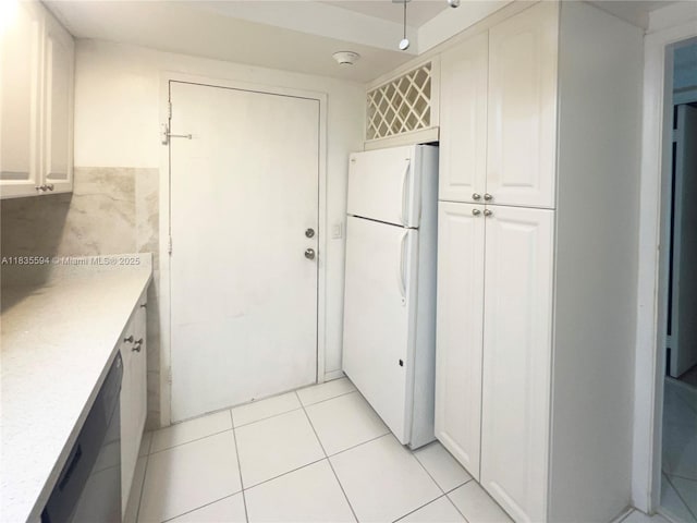 2000 S Ocean Blvd Unit 16P, Lauderdale By The Sea, FL 33062 - kitchen featuring freestanding refrigerator, light countertops, light tile patterned floors, white cabinets, and dishwasher