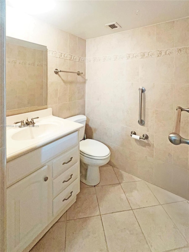 2000 S Ocean Blvd Unit 16P, Lauderdale By The Sea, FL 33062 - bathroom featuring vanity, tile patterned flooring, and tile walls
