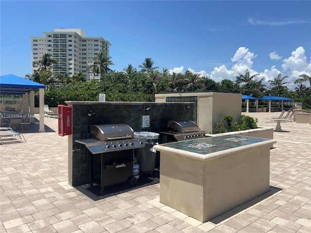 2000 S Ocean Blvd Unit 16P, Lauderdale By The Sea, FL 33062 - view of patio / terrace featuring a gazebo and an outdoor kitchen