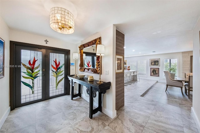 10321 SW 102nd Ave, Miami, FL 33176 - foyer with french doors, light marble finish floors, and a chandelier