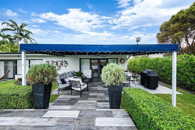 10321 SW 102nd Ave, Miami, FL 33176 - view of patio featuring area for grilling, an outdoor living space, and french doors
