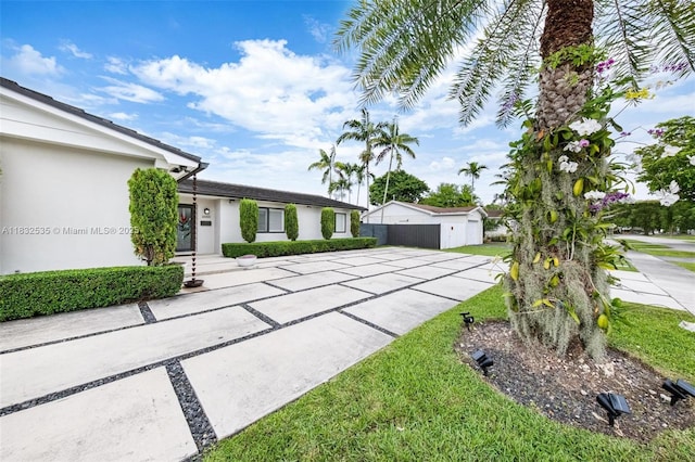 10321 SW 102nd Ave, Miami, FL 33176 - view of front of home featuring stucco siding and a front yard