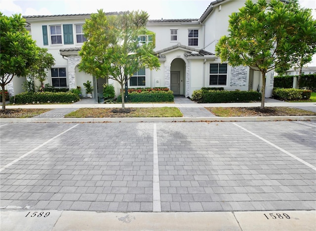 1589 SE 26th Rd, Homestead, FL 33035 - multi unit property with uncovered parking, stucco siding, a tiled roof, and stone siding