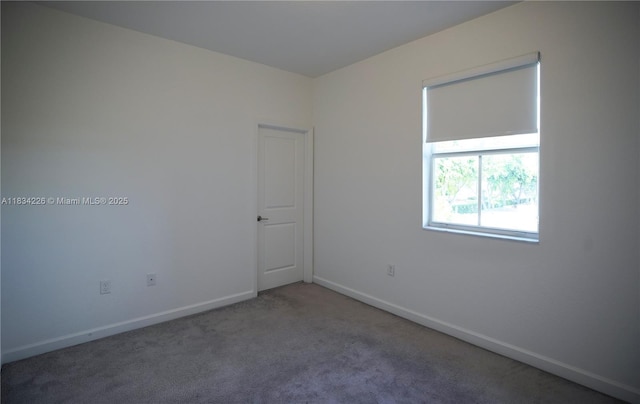 1589 SE 26th Rd, Homestead, FL 33035 - unfurnished room featuring carpet flooring and baseboards