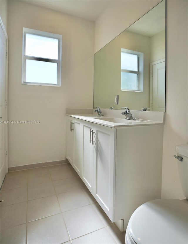 1589 SE 26th Rd, Homestead, FL 33035 - bathroom featuring double vanity and tile patterned flooring