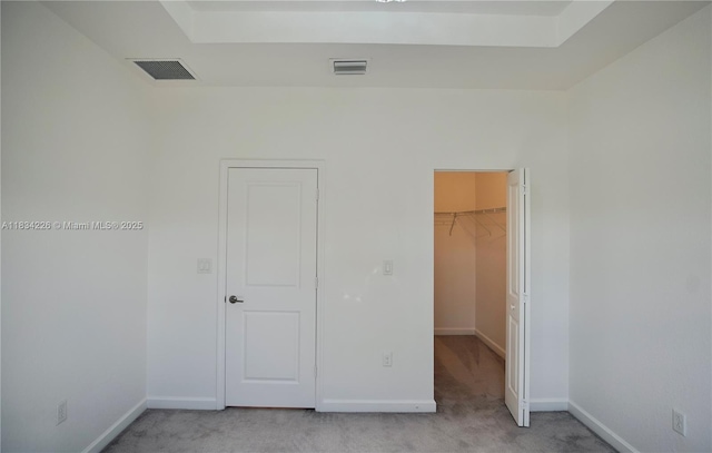 1589 SE 26th Rd, Homestead, FL 33035 - unfurnished bedroom featuring a walk in closet, light colored carpet, and a closet