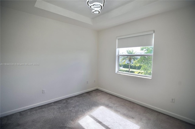 1589 SE 26th Rd, Homestead, FL 33035 - carpeted spare room featuring baseboards and a raised ceiling