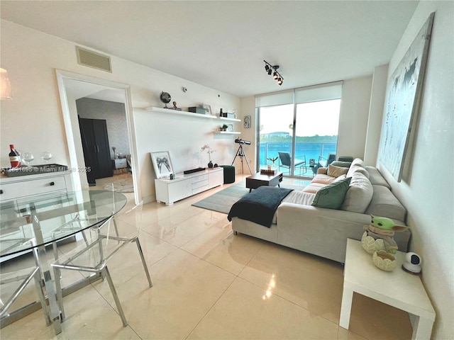 2641 N Flamingo Rd Unit 605N, Sunrise, FL 33323 - living area featuring light tile patterned flooring and rail lighting