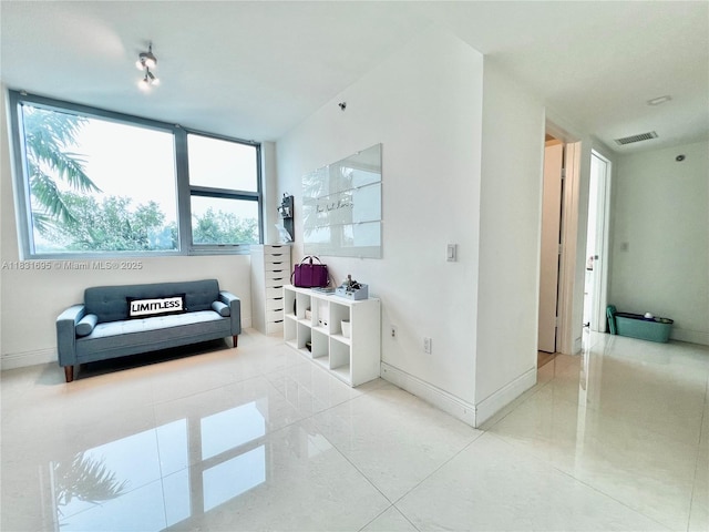 2641 N Flamingo Rd Unit 605N, Sunrise, FL 33323 - living room featuring baseboards