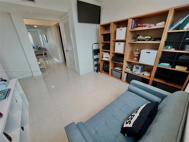 2641 N Flamingo Rd Unit 605N, Sunrise, FL 33323 - living area featuring baseboards and tile patterned floors