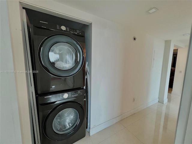 2641 N Flamingo Rd Unit 605N, Sunrise, FL 33323 - washroom with stacked washer / drying machine and light tile patterned flooring