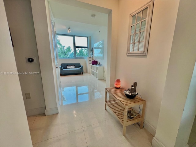 2641 N Flamingo Rd Unit 605N, Sunrise, FL 33323 - corridor featuring baseboards and light tile patterned floors