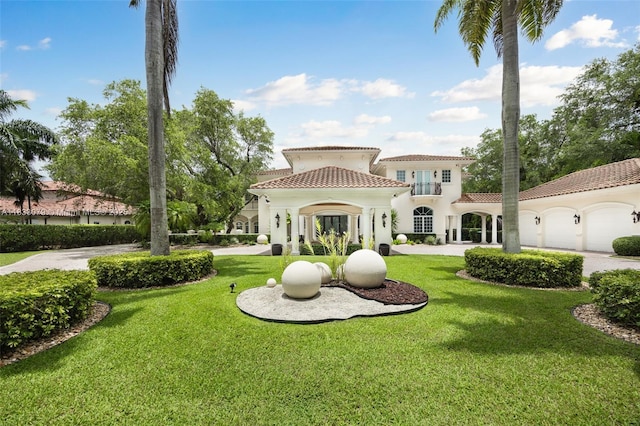7245 SW 104th St, Pinecrest, FL 33156 - rear view of house featuring a lawn, a tile roof, an attached garage, and stucco siding