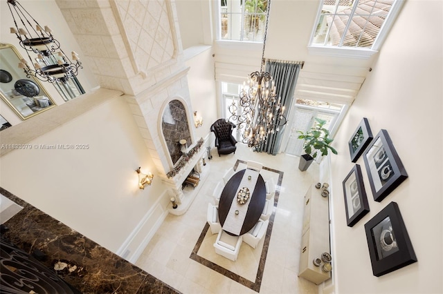 7245 SW 104th St, Pinecrest, FL 33156 - living area featuring a high ceiling and a chandelier