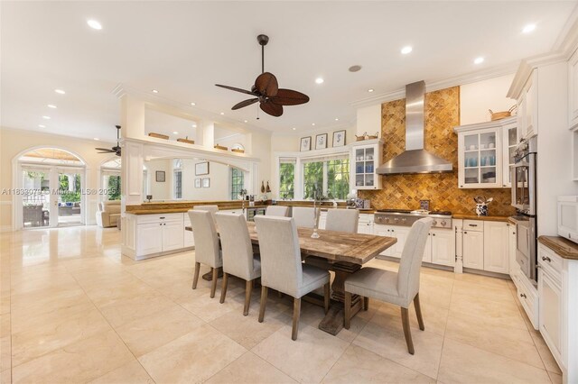 7245 SW 104th St, Pinecrest, FL 33156 - dining room with a ceiling fan, recessed lighting, ornamental molding, light tile patterned floors, and french doors