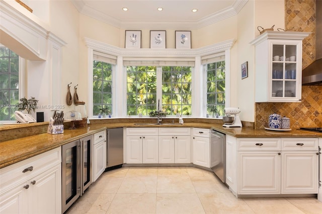 7245 SW 104th St, Pinecrest, FL 33156 - kitchen with beverage cooler, dishwasher, fridge, dark stone counters, and white cabinets