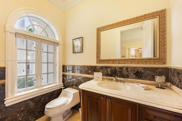 7245 SW 104th St, Pinecrest, FL 33156 - bathroom featuring ornamental molding, vanity, tile walls, and a wainscoted wall