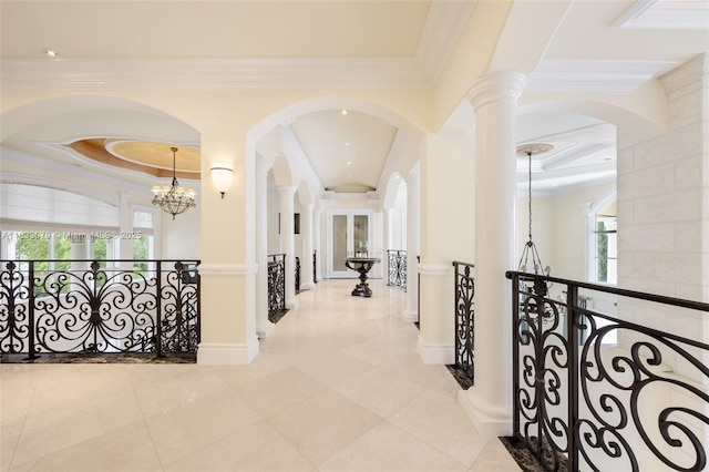 7245 SW 104th St, Pinecrest, FL 33156 - hallway featuring healthy amount of natural light, ornamental molding, an upstairs landing, and a chandelier