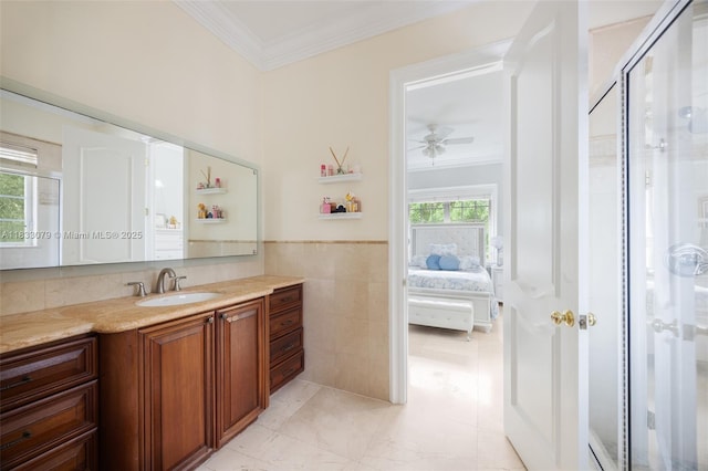 7245 SW 104th St, Pinecrest, FL 33156 - bathroom featuring crown molding, vanity, ceiling fan, connected bathroom, and a stall shower