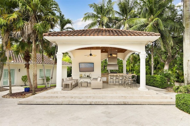 7245 SW 104th St, Pinecrest, FL 33156 - view of patio with an outdoor living space, a ceiling fan, and exterior bar