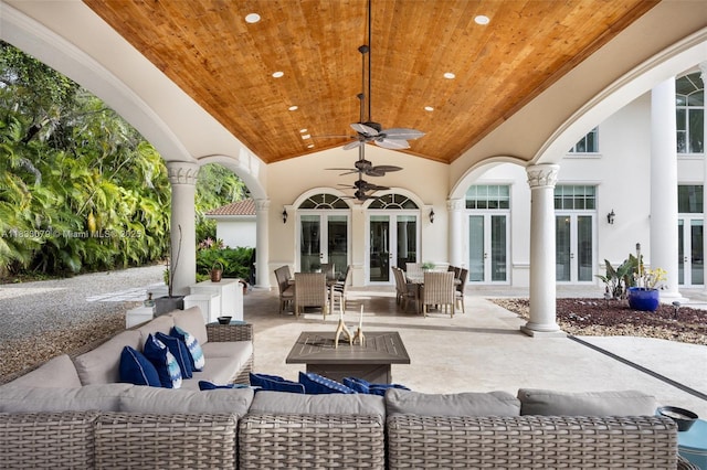 7245 SW 104th St, Pinecrest, FL 33156 - view of patio with french doors, an outdoor living space with a fire pit, and outdoor dining area