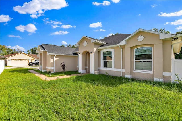 334 Colony St, Kissimmee, FL 34758 - single story home featuring stucco siding and a front lawn