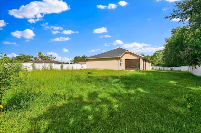 334 Colony St, Kissimmee, FL 34758 - fenced backyard with a sunroom