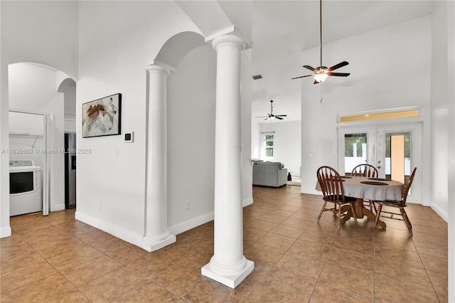 334 Colony St, Kissimmee, FL 34758 - dining space featuring washer / dryer, ceiling fan, a towering ceiling, tile patterned flooring, and french doors